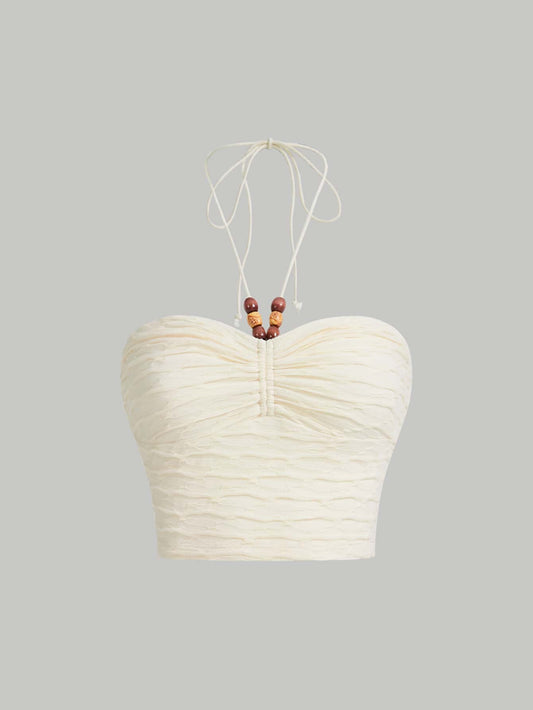 Senmanika ĉemizo kun krucitaj rimenoj sur la dorso, falbaloj